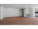 Clean garage interior featuring white walls, sealed concrete floors, and a textured glass block accent wall at 380 Gulf Of Mexico Dr # 536, Longboat Key, FL 34228