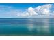 Breathtaking view of clear, turquoise ocean waters with distant shoreline and picturesque cloudy sky above at 380 Gulf Of Mexico Dr # 536, Longboat Key, FL 34228