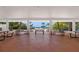 View of the beach from the Community Pavilion area with multiple picnic tables, and a beach volleyball court at 380 Gulf Of Mexico Dr # 536, Longboat Key, FL 34228