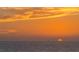 Beautiful image of a sunset over the ocean, with yellow and orange clouds at 380 Gulf Of Mexico Dr # 536, Longboat Key, FL 34228