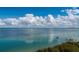 Calming water view showcasing pier, clear sky, and turquoise-blue water at 380 Gulf Of Mexico Dr # 536, Longboat Key, FL 34228