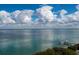 Expansive water view featuring a pier, bright clouds, and serene blues at 380 Gulf Of Mexico Dr # 536, Longboat Key, FL 34228