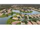 Community overview with lake and homes at 4104 Reflections Pkwy, Sarasota, FL 34233