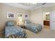 Guest bedroom with twin beds and access to bathroom at 4104 Reflections Pkwy, Sarasota, FL 34233