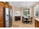 Cozy breakfast nook with table and chairs, adjacent to kitchen at 4104 Reflections Pkwy, Sarasota, FL 34233