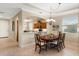 Dining room with wood table and chairs, kitchen access at 4104 Reflections Pkwy, Sarasota, FL 34233