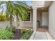 Front entry with a tiled walkway and lush landscaping at 4104 Reflections Pkwy, Sarasota, FL 34233