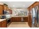 Spacious kitchen with stainless steel appliances and wood cabinets at 4104 Reflections Pkwy, Sarasota, FL 34233