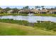 Community lake with fountain and lush landscaping at 4104 Reflections Pkwy, Sarasota, FL 34233