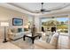 Living Room with beige sofas and access to a patio overlooking a lake at 4104 Reflections Pkwy, Sarasota, FL 34233