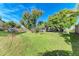 Landscaped backyard offering ample green space at 4410 70Th E Dr, Sarasota, FL 34243