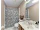 Bathroom featuring shower/tub combo and vanity with updated sink and faucet at 4410 70Th E Dr, Sarasota, FL 34243