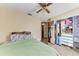 Bedroom with ceiling fan, double bed, and large closet at 4410 70Th E Dr, Sarasota, FL 34243