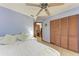 Spacious bedroom with ample closet space and ensuite bathroom at 4410 70Th E Dr, Sarasota, FL 34243