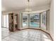 Dining room with large windows overlooking the pool at 4410 70Th E Dr, Sarasota, FL 34243