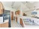 View of kitchen with stainless steel appliances and ample counter space at 4410 70Th E Dr, Sarasota, FL 34243