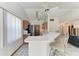 Bright kitchen area featuring a breakfast bar with seating and views to other rooms of the house at 4410 70Th E Dr, Sarasota, FL 34243