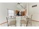 Kitchen area featuring a breakfast bar with seating and views to other rooms of the house at 4410 70Th E Dr, Sarasota, FL 34243