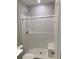 Bathroom with toilet, shower and built-in bench at 4432 Collingswood Blvd, Port Charlotte, FL 33948