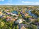 Aerial of upscale community with lake and variety of homes at 4941 Bridgehampton Blvd, Sarasota, FL 34238