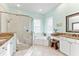 Spa-like bathroom with granite countertops, soaking tub, and walk-in shower at 4941 Bridgehampton Blvd, Sarasota, FL 34238