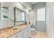 Bathroom with granite countertop, white cabinets, and a shower/tub combo at 4941 Bridgehampton Blvd, Sarasota, FL 34238