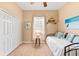 Bright bedroom with a daybed, built-in closet, and coastal decor at 4941 Bridgehampton Blvd, Sarasota, FL 34238