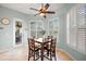 Bright breakfast nook features a table with four chairs and plantation shutters at 4941 Bridgehampton Blvd, Sarasota, FL 34238