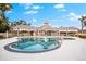 Community pool with clubhouse and relaxing patio area at 4941 Bridgehampton Blvd, Sarasota, FL 34238