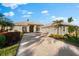 Single-story home with tile roof, two-car garage, and landscaped yard at 4941 Bridgehampton Blvd, Sarasota, FL 34238