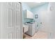 Bright laundry room with washer, dryer, and cabinets at 4941 Bridgehampton Blvd, Sarasota, FL 34238