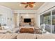 Bright living room with comfy sofas, a large TV, and sliding doors leading to the backyard at 4941 Bridgehampton Blvd, Sarasota, FL 34238