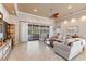 Living area with sliding glass doors leading to the backyard and pool at 4941 Bridgehampton Blvd, Sarasota, FL 34238