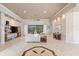 Spacious living room with high ceilings, a neutral color palette, and tile flooring at 4941 Bridgehampton Blvd, Sarasota, FL 34238