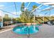 Inviting screened pool and spa with ample patio space at 4941 Bridgehampton Blvd, Sarasota, FL 34238