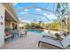 Spacious screened patio with pool, spa, and lounge chairs at 4941 Bridgehampton Blvd, Sarasota, FL 34238