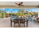 Spacious screened-in pool and patio area with seating at 4941 Bridgehampton Blvd, Sarasota, FL 34238