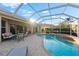 Inviting pool and spa with covered patio, perfect for outdoor entertaining at 4941 Bridgehampton Blvd, Sarasota, FL 34238