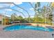 Relaxing screened pool and spa with brick pavers at 4941 Bridgehampton Blvd, Sarasota, FL 34238