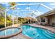 Inviting pool and spa with a screened enclosure at 4941 Bridgehampton Blvd, Sarasota, FL 34238