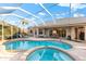 Relaxing pool and spa with covered patio at 4941 Bridgehampton Blvd, Sarasota, FL 34238