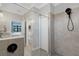 Bathroom with walk-in shower and glass enclosure at 5035 Seafoam Trl, Bradenton, FL 34211