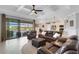 Open concept living room with a view of the kitchen and pool at 5035 Seafoam Trl, Bradenton, FL 34211