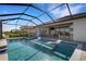 Inviting pool with a covered lanai and lounge chairs at 5035 Seafoam Trl, Bradenton, FL 34211