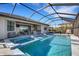 Stunning pool with spa and screened enclosure overlooking lake at 5035 Seafoam Trl, Bradenton, FL 34211