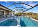 Relaxing pool and spa with covered lanai and outdoor kitchen at 5035 Seafoam Trl, Bradenton, FL 34211