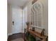 Charming entryway with a rustic console table and mirror at 5233 Blossom Cv, Lakewood Ranch, FL 34211