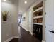 Built-in shelving and a home bar are in this hallway at 5233 Blossom Cv, Lakewood Ranch, FL 34211