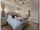 Large bedroom with ensuite bathroom and plush bedding at 5233 Blossom Cv, Lakewood Ranch, FL 34211