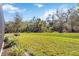 Landscaped backyard with lush green grass at 5255 Cicerone St, Sarasota, FL 34238